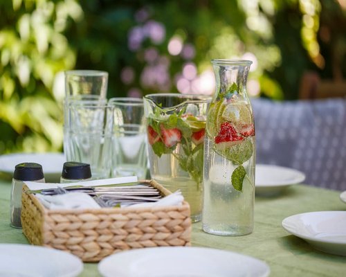 Fresh green tea or refreshing water served on an outdoor terrace table